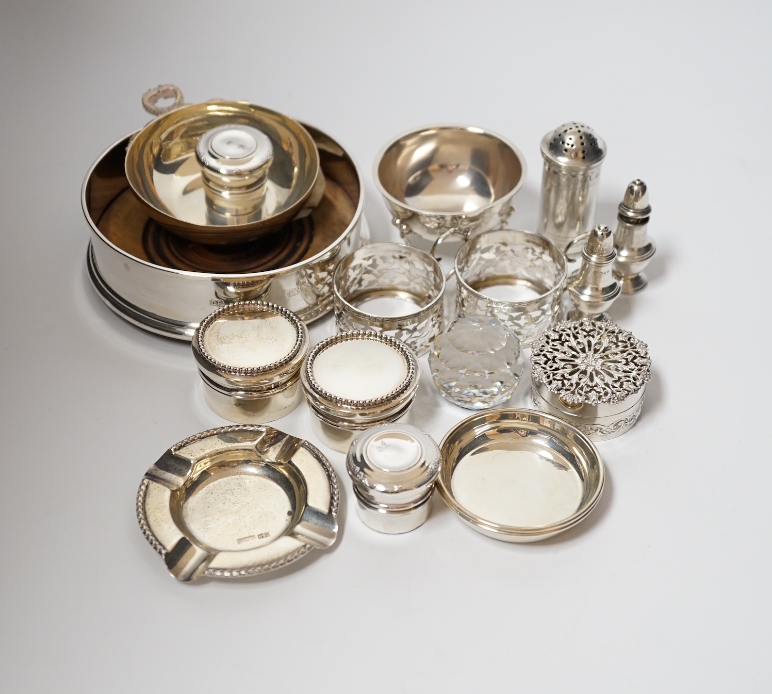 A small collection of sundry small silver including modern silver mounted wine coaster, coffee can holders, salt, taste vin, pot pourri box, pill boxes, Georgian pepperette, small dishes etc.